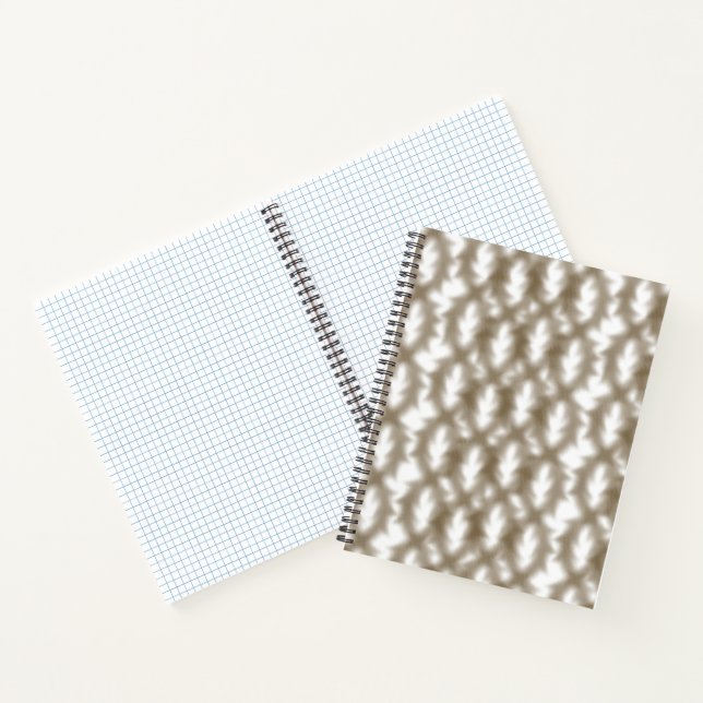 A close-up view of a crisscrossing wire mesh grid  notebook (Inside)