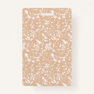 A close-up view of a textured wall featuring patte ID badge