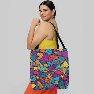 A colourful abstract pattern composed geometric  tote bag