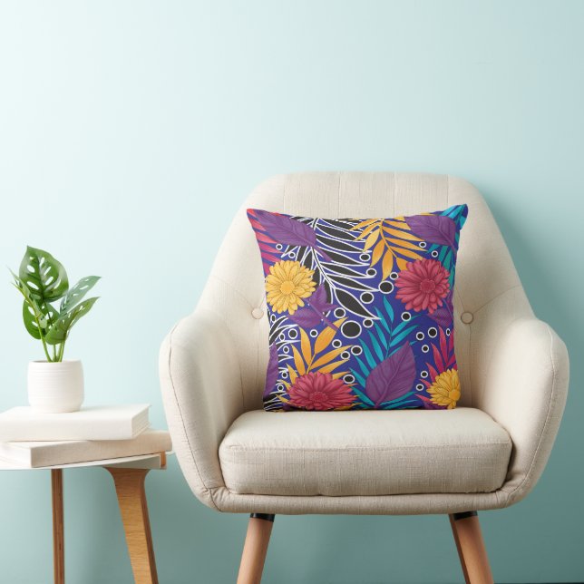 a colourful flower and leaves pattern on a blue ba cushion (Chair)