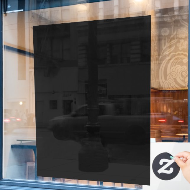 A completely black image with a subtle textured  (Cafe Window)