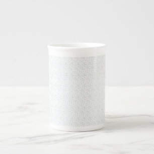 A completely white, featureless surface fills the bone china mug