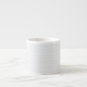 A completely white, featureless surface fills the espresso cup
