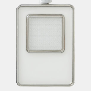A completely white, featureless surface fills the silver plated framed ornament