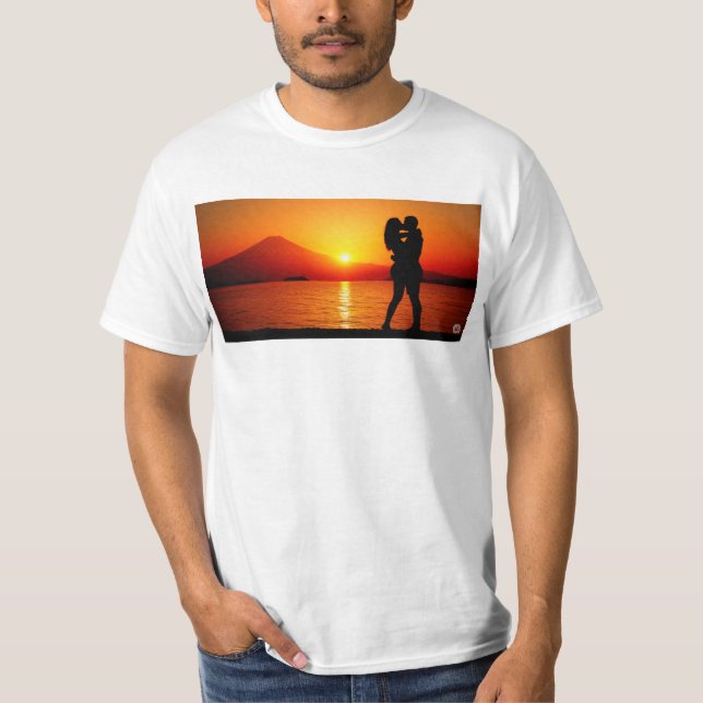 A couple hugging each other on the shore of Mt. Fu T-Shirt (Front)
