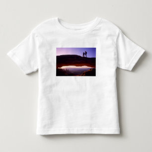 A couple watches sunrise from atop Mesa Arch in Toddler T-Shirt