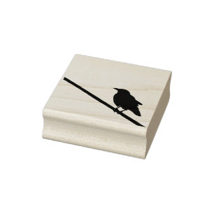 A crow on a power line rubber stamp