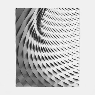 A CURVED FACADE COVERED IN WHITE LATTICEWORK FLEECE BLANKET