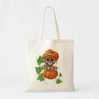 A cute puppy with big eyes in a pumpkin hat tote bag