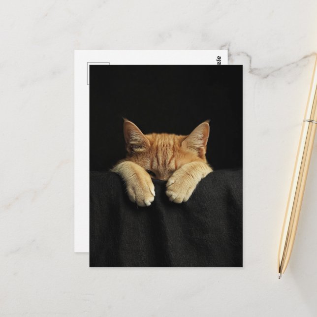 A Cute Sleepy Ginger Kitty Hanging Off the Bed Postcard (Front/Back In Situ)