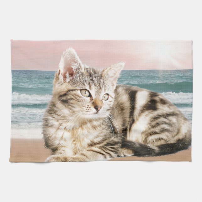 A Cuter Striped Cat Sitting on Beach with sunset Tea Towel (Horizontal)