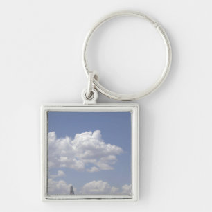 A CV-22 Osprey flies over a C-130 Hercules Key Ring