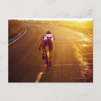 A cyclist on road bike near Great Salt Lake Postcard