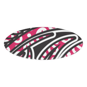 A decorative paisley design with vivid red and pin name tag