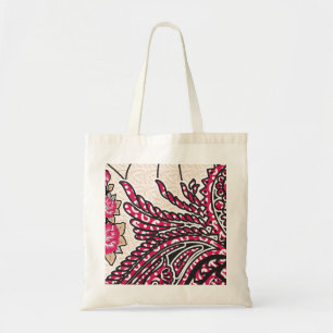A decorative paisley design with vivid red and pin tote bag