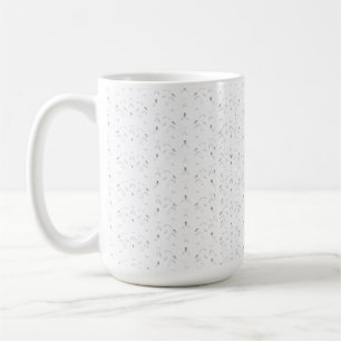 A decorative pattern featuring white and grey leav coffee mug