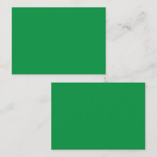 A dense, lush forest filled with vibrant green tre appointment card