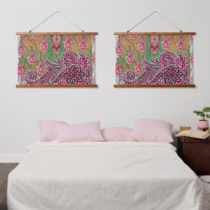 a design of a pink and brown paisley pattern hanging tapestry