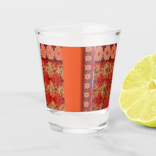 a design of a red and gold pattern shot glass
