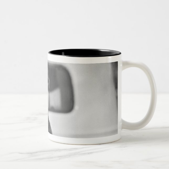 A dog in a car. Two-Tone coffee mug (Right)