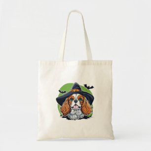 A dog wearing a witches hat with bats tote bag