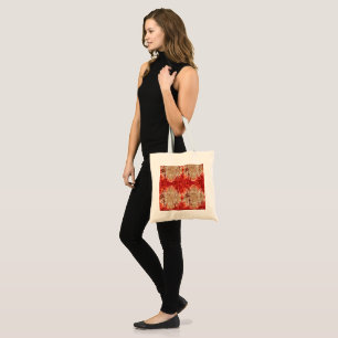 A fabric displaying an orange and brown pattern, tote bag