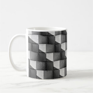 A face of the "Four Sided Pyramid" sculpture in th Coffee Mug