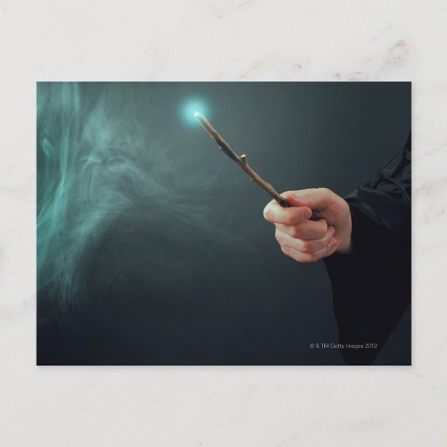 A fantasy wizard making magic with wand. postcard (Front)