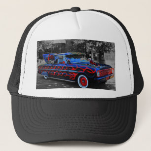 A flaming old car, oon a truckers hat