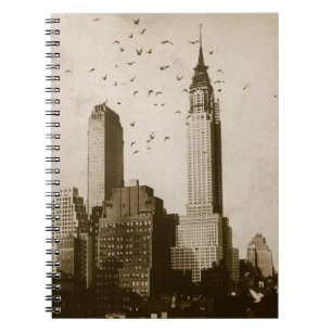 A flock of birds flying spiral notebook