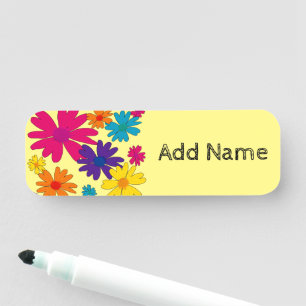 A floral bed of daisy flowers  name tag