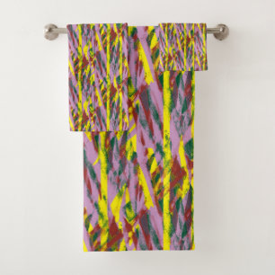 A fluffy grey cat with green eyes sits on a window bath towel set