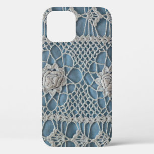 A fragment of a wide lace insert contains small wh iPhone 12 case