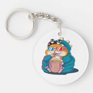 A funny hamster wearing glasses eats popcorn key ring