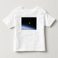 A gibbous moon visible above Earth's atmosphere 2