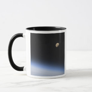 A gibbous moon visible above Earth's atmosphere Mug