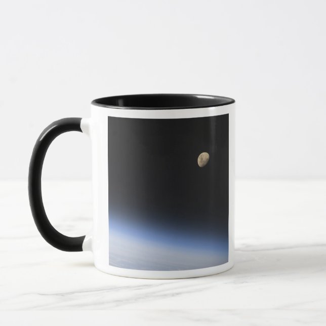 A gibbous moon visible above Earth's atmosphere Mug (Left)