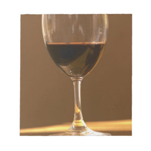 A glass of red Chateau Belgrave in sunlight - Notepad