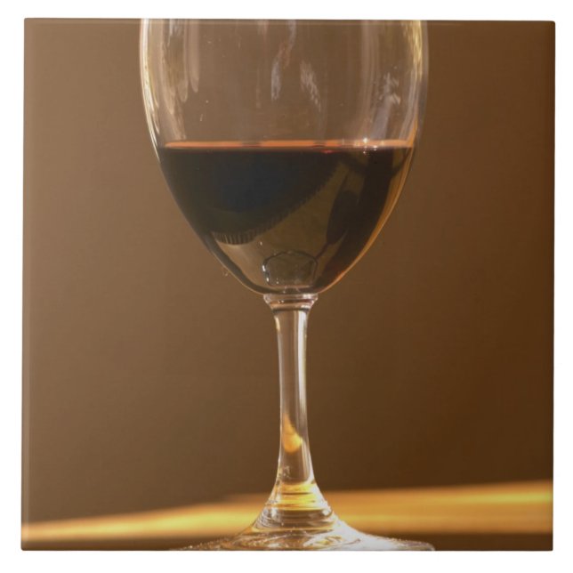 A glass of red Chateau Belgrave in sunlight - Tile (Front)