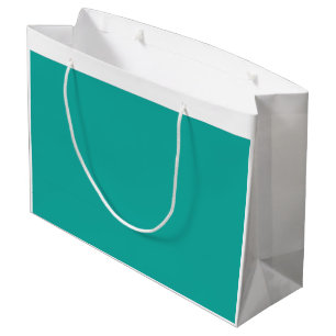 A gradient background blending blue into green. large gift bag