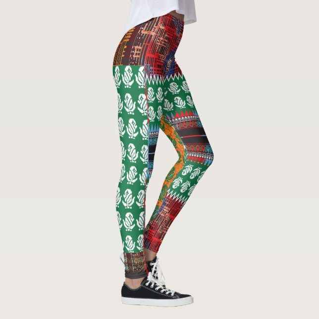 a green and black pattern with a tree in the middl leggings (Right)