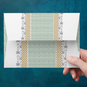 a green and white background with small leaves envelope
