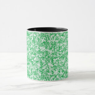 a green and white background with small white dots mug