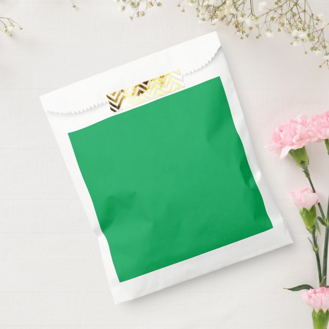 a green background with a favour bags (Sealed)