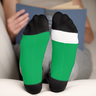 a green background with a socks