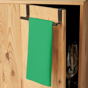 a green background with a tea towel