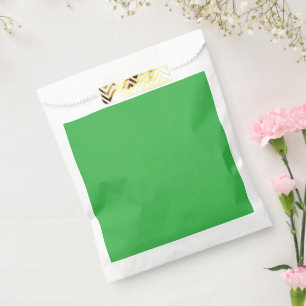 a green background with a white border favour bags