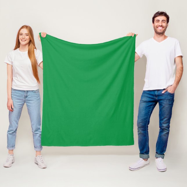 a green background with a white border fleece blanket (In Situ)