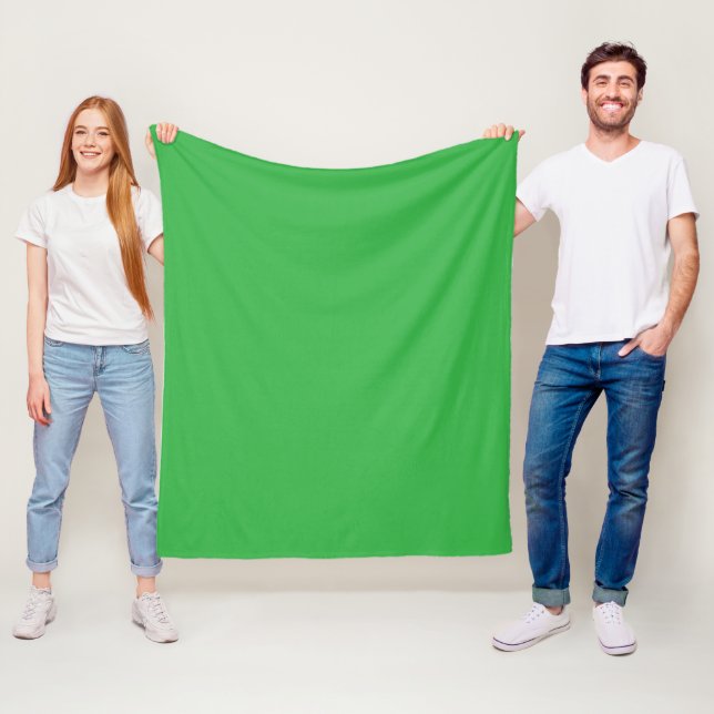 a green background with a white border fleece blanket (In Situ)