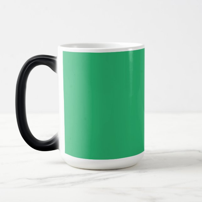 a green background with a white border magic mug (Left)